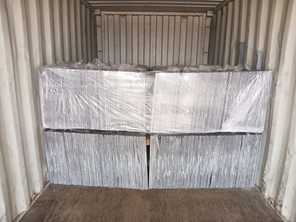 a stack natural stone slabs in a shipping container