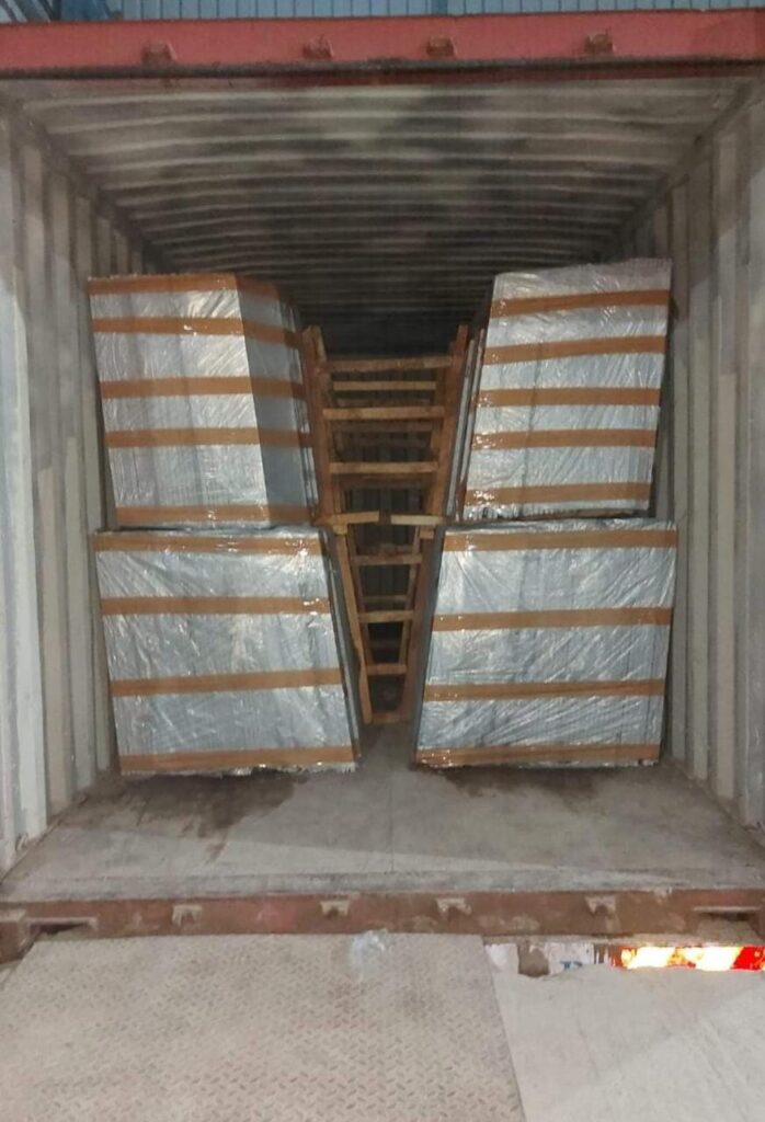 a container with boxes of marble slabs inside