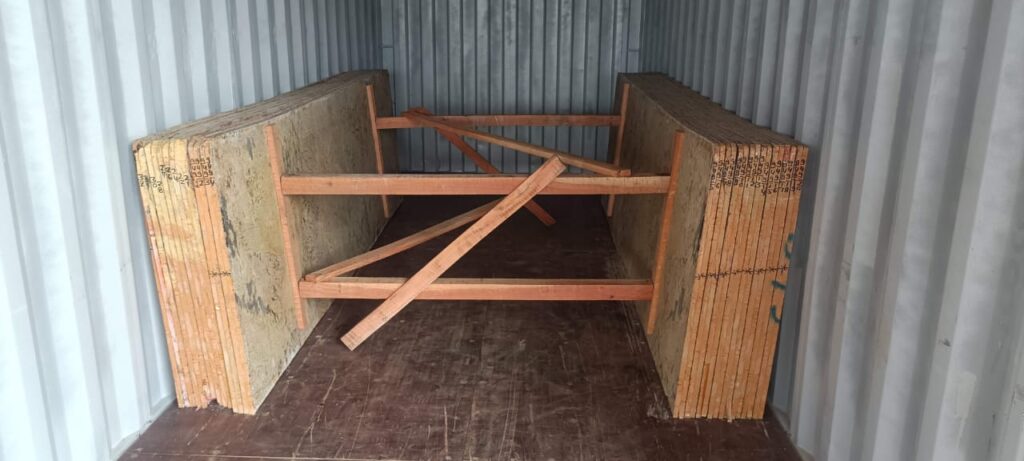 a wood structure for delivering natural stone products in a container